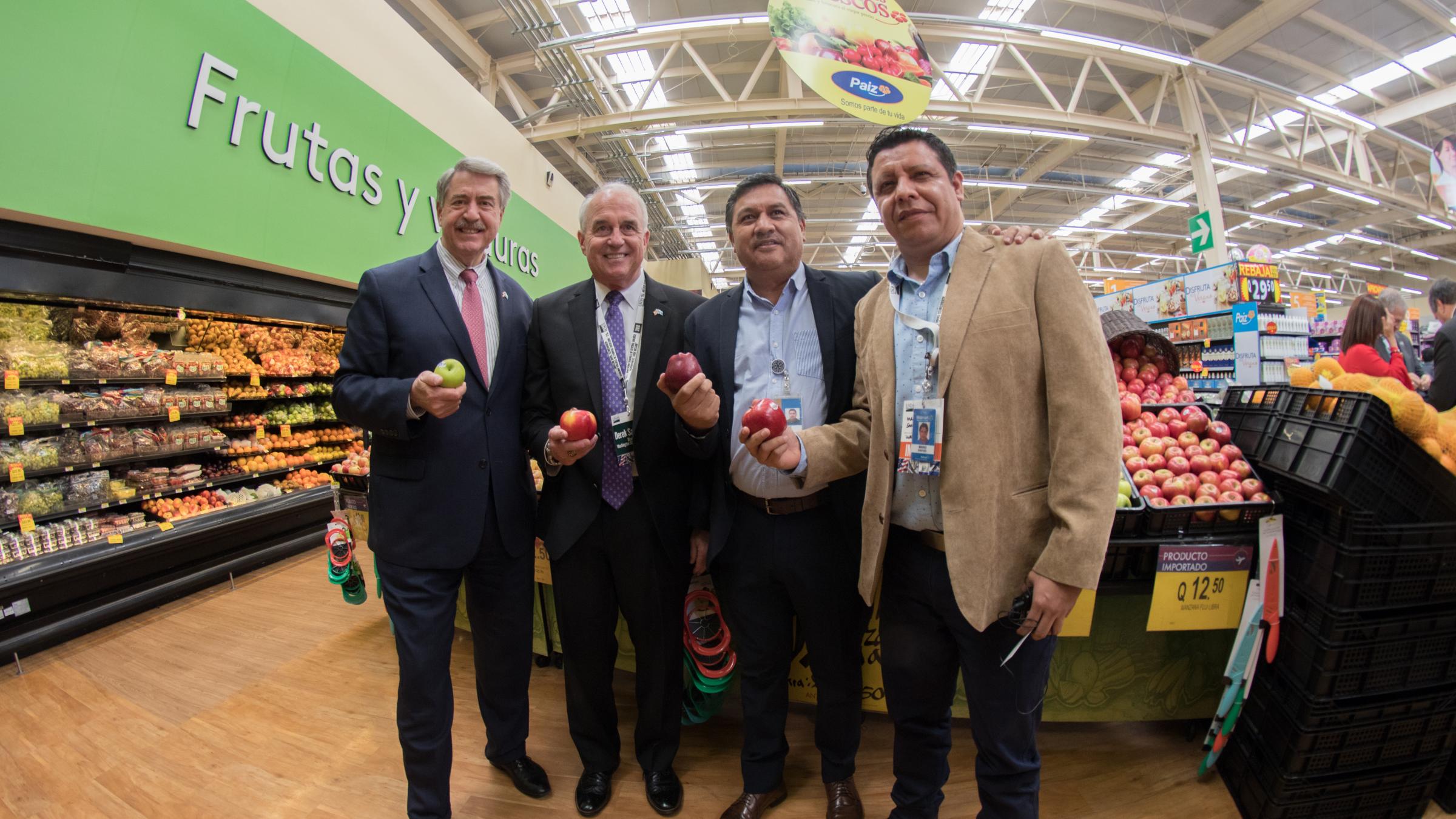Viewing the Washington State apples and other high-quality U.S. produce for sale at the Wal-Mart-owned Paiz Supermarket in San Lucas Sacatepéquez, Guatemala.