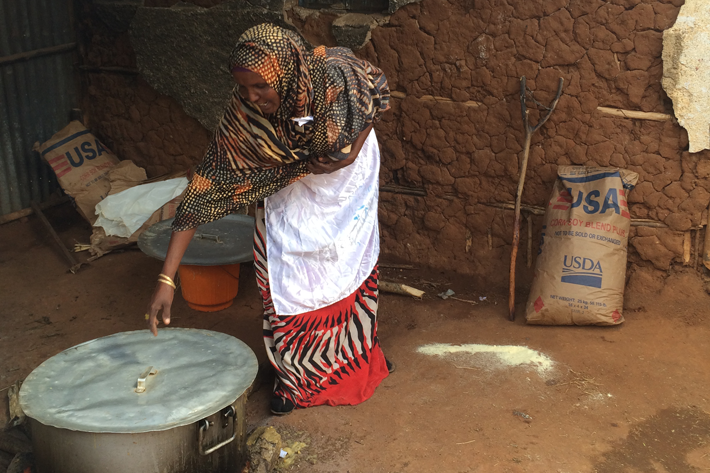 A parent volunteer uses USDA-supplied corn-soy blend to prepare a nutritious porridge for school children in eastern Ethiopia. A parent volunteer uses USDA-supplied corn-soy blend to prepare a nutritious porridge for school children in eastern Ethiopia.