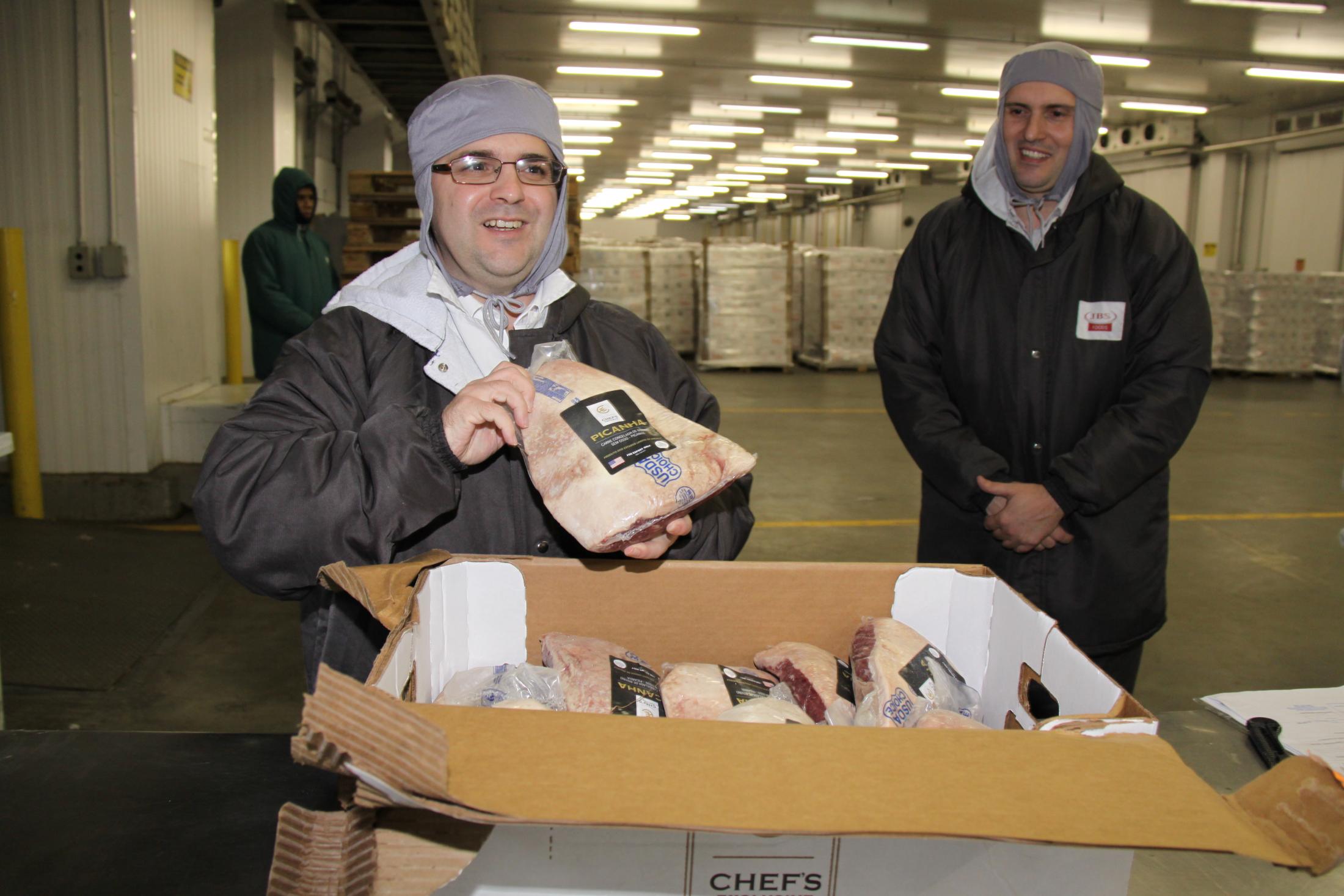Consul General Ricardo Zuniga with the boxes of U.S. beef as they clear customs in Brazil, ready to hit the market. Consul General Ricardo Zuniga with the boxes of U.S. beef as they clear customs in Brazil, ready to hit the market.