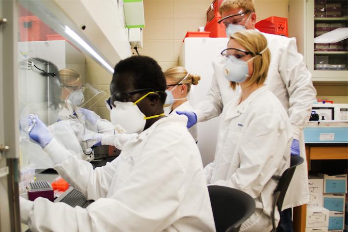 Borlaug fellow Stella Atim of Uganda (left) studies tissue samples in the lab at the University of Wyoming. Borlaug fellow Stella Atim of Uganda (left) studies tissue samples in the lab at the University of Wyoming.