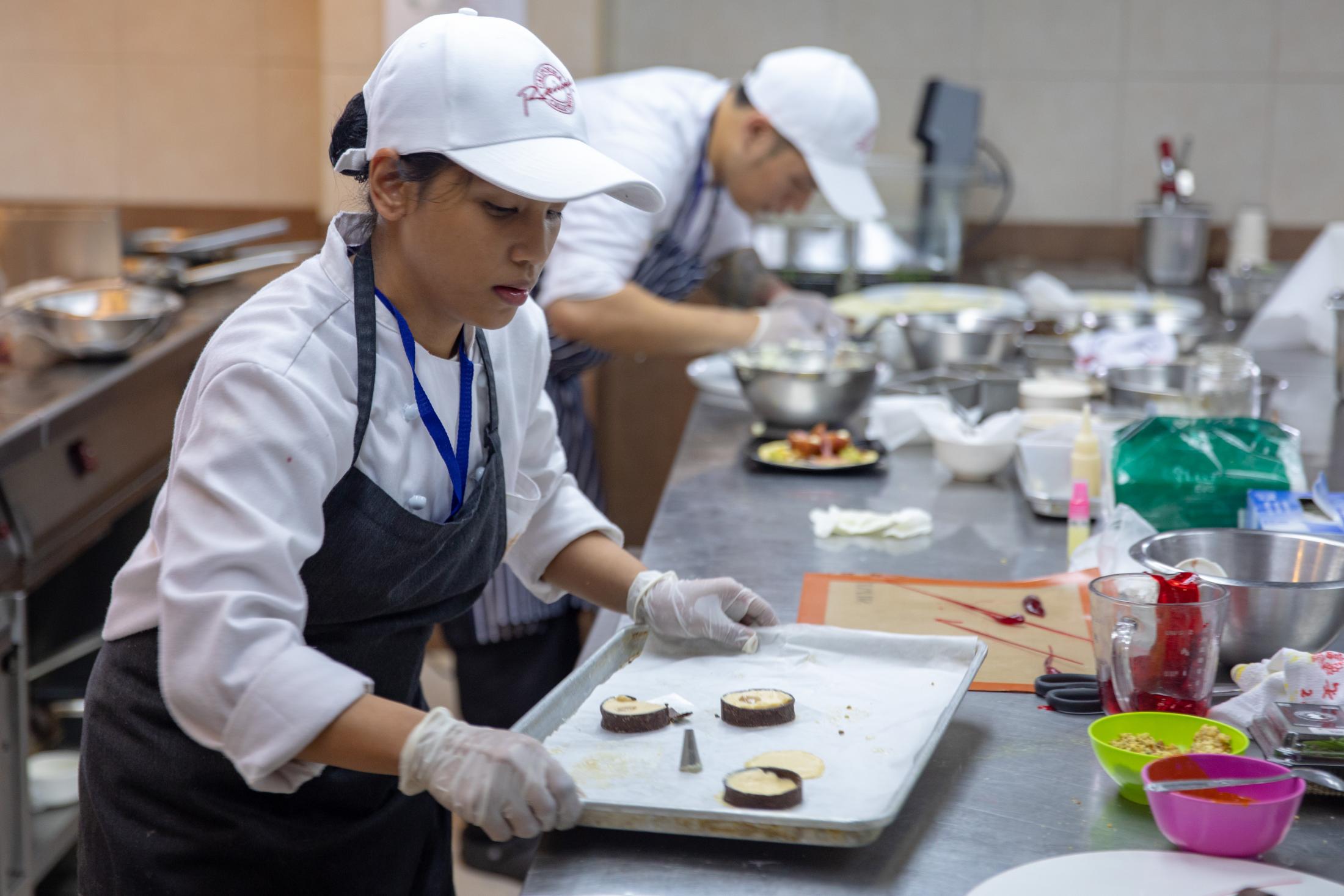 A culinary student from Lyceum of the Philippines University uses U.S. almonds to make mousse.